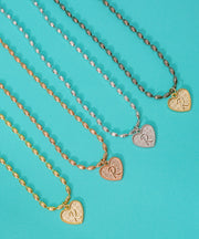 (L) Heart Initial Charm in Three Finishes